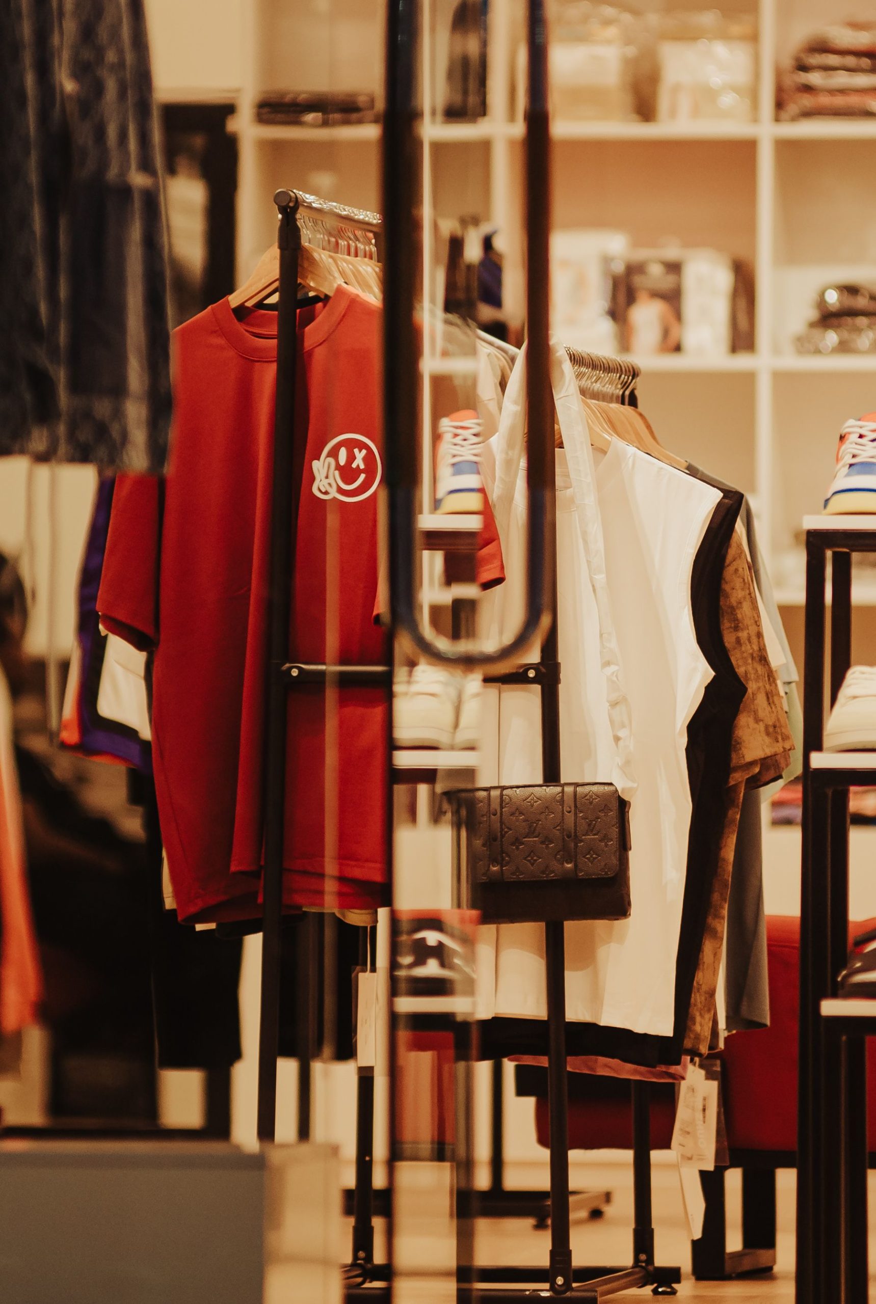 Stylish interior of a modern clothing store featuring a variety of colorful apparel and accessories.